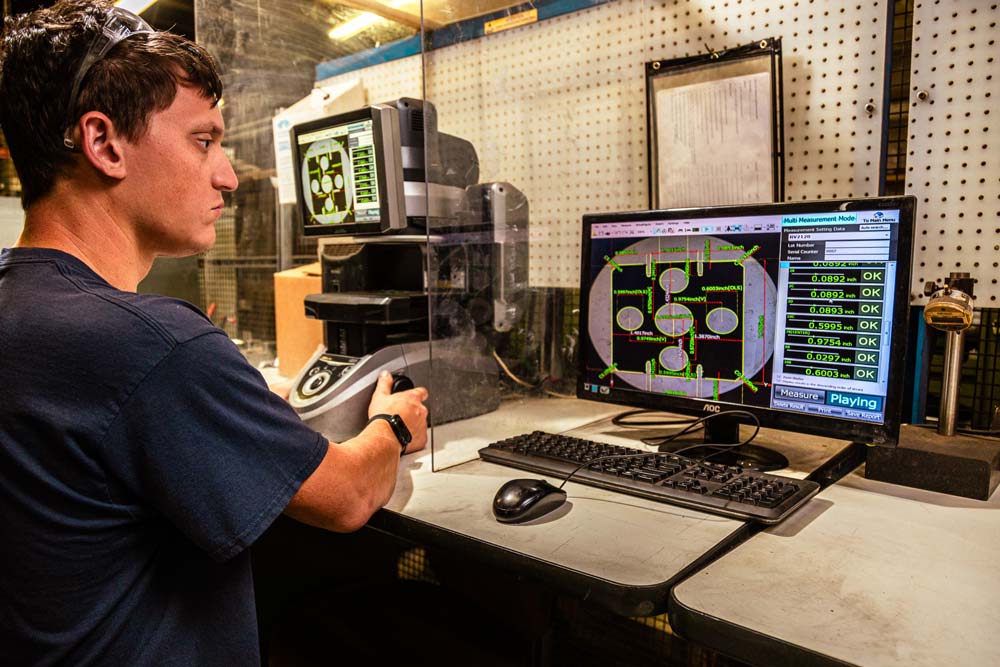GP2-op-at-vision-system-cropped Precision metal stamped parts